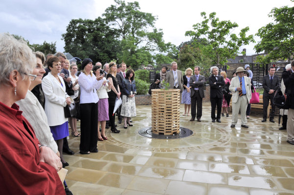 Watching the unveiling. The black poplar, planted to commemorate the Diamond Jubilee, is in the centre.