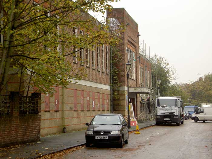 Scaffolding being erected against the facade